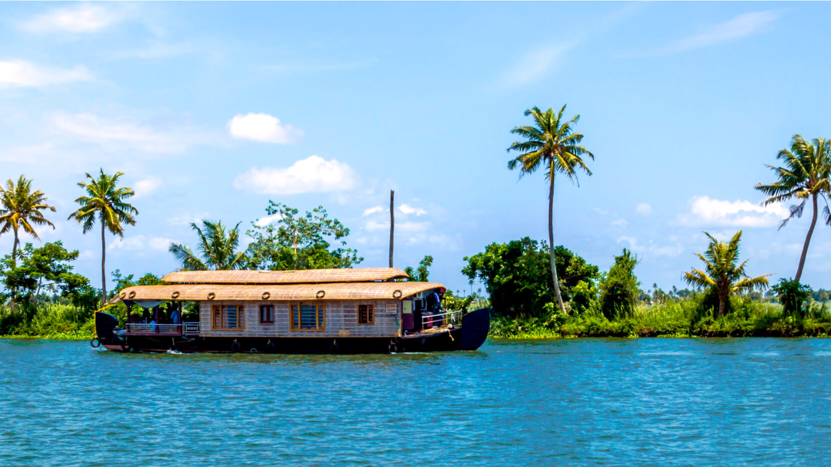 brown house boat in water in alleppey kerala