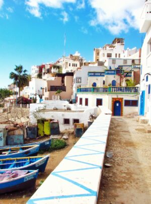 boatd docked near houses and body of water