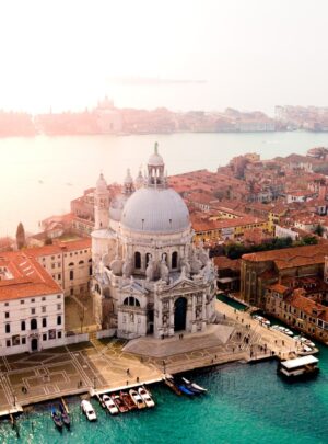 aerial photo of concrete buildings near calm water