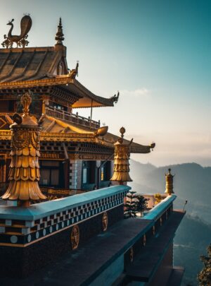brown and green temple on top of mountain during daytime