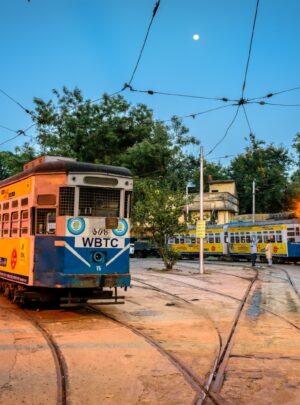 yellow and white tram on road during daytime