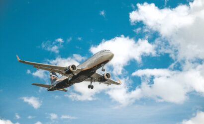 white airplane under blue sky during daytime
