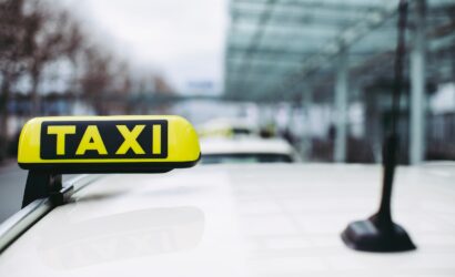 yellow and black taxi sign